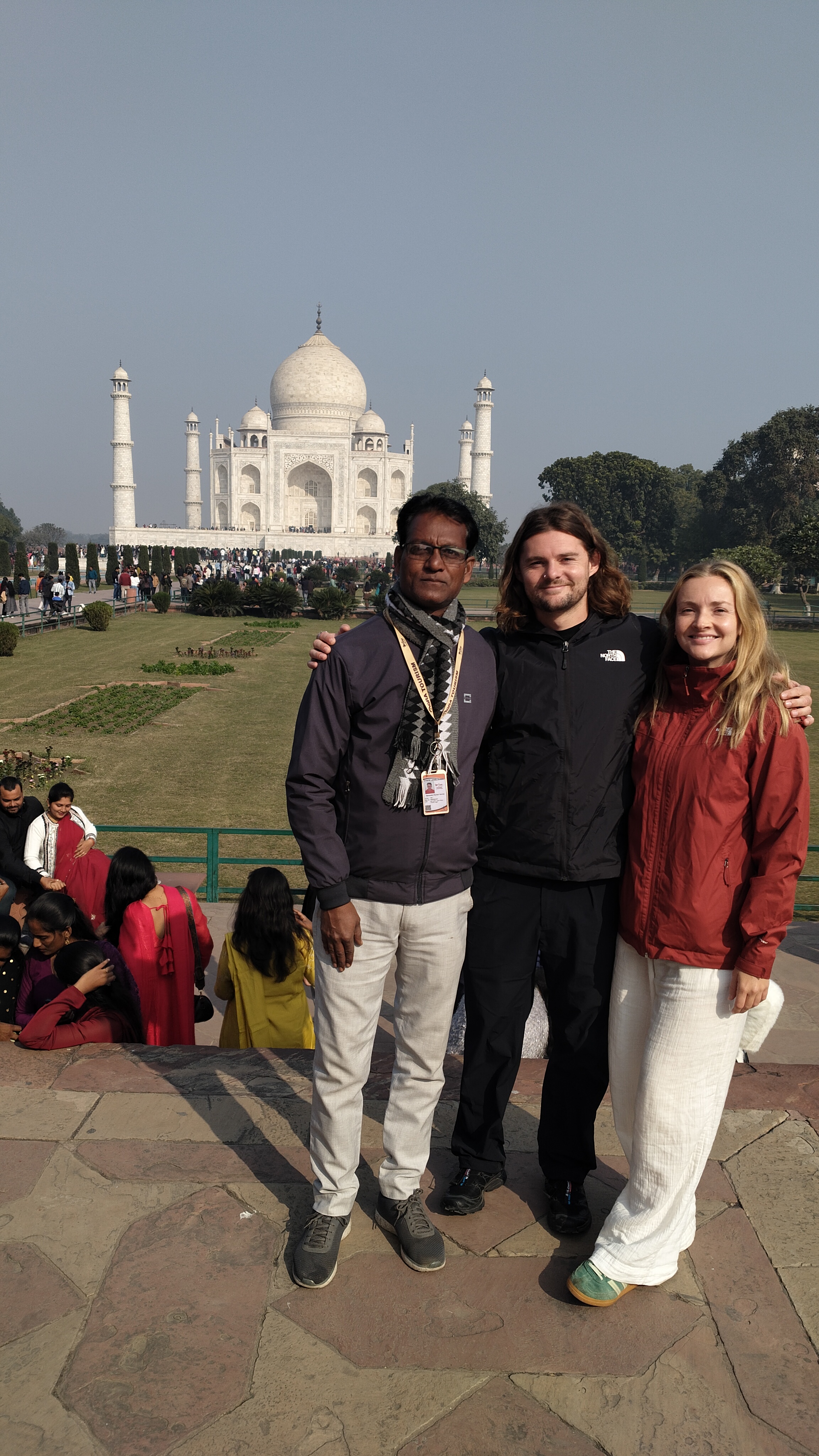 Mr. Verma with tourists smiling
